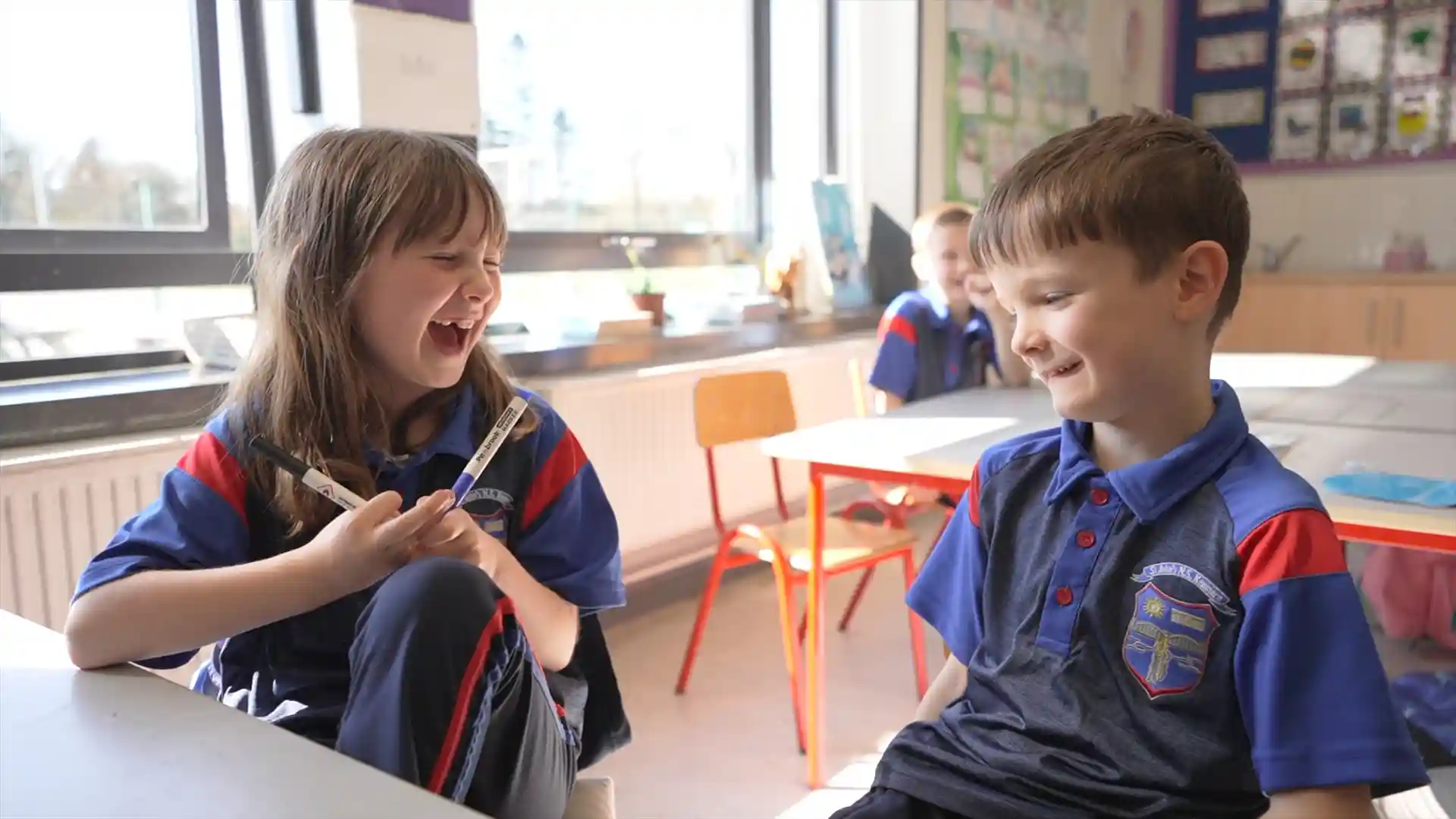 Two children laughing at St. John's National School, Kenmare